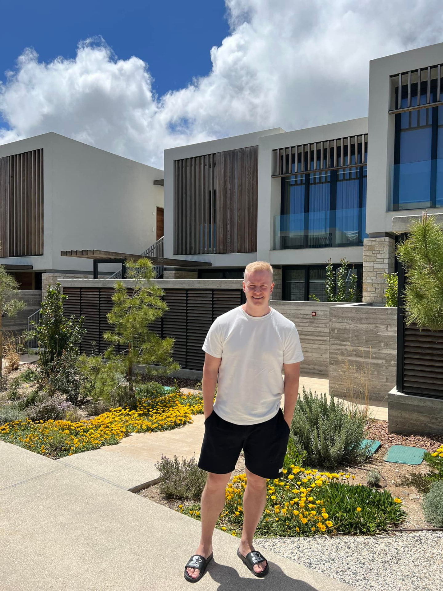 Gusten Sun outside a modern home