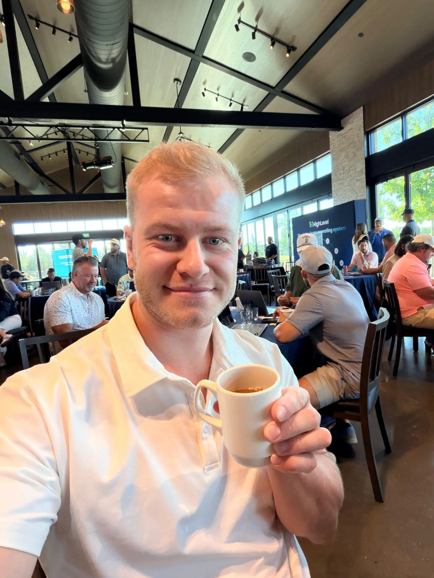 Gusten Sun enjoying coffee at an event